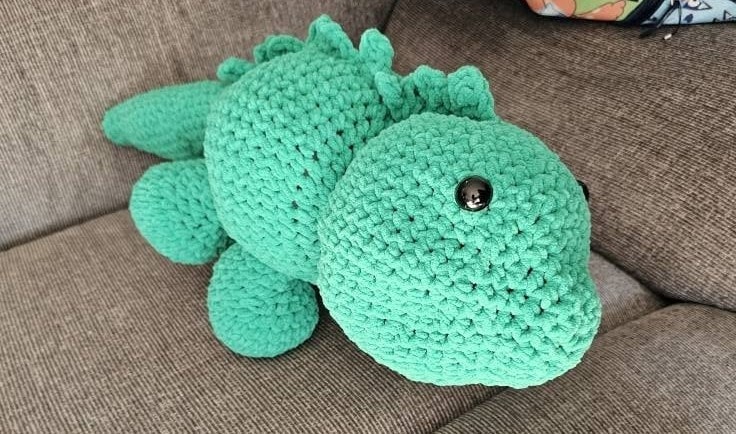 My first amigurumi — a crocheted green lizard